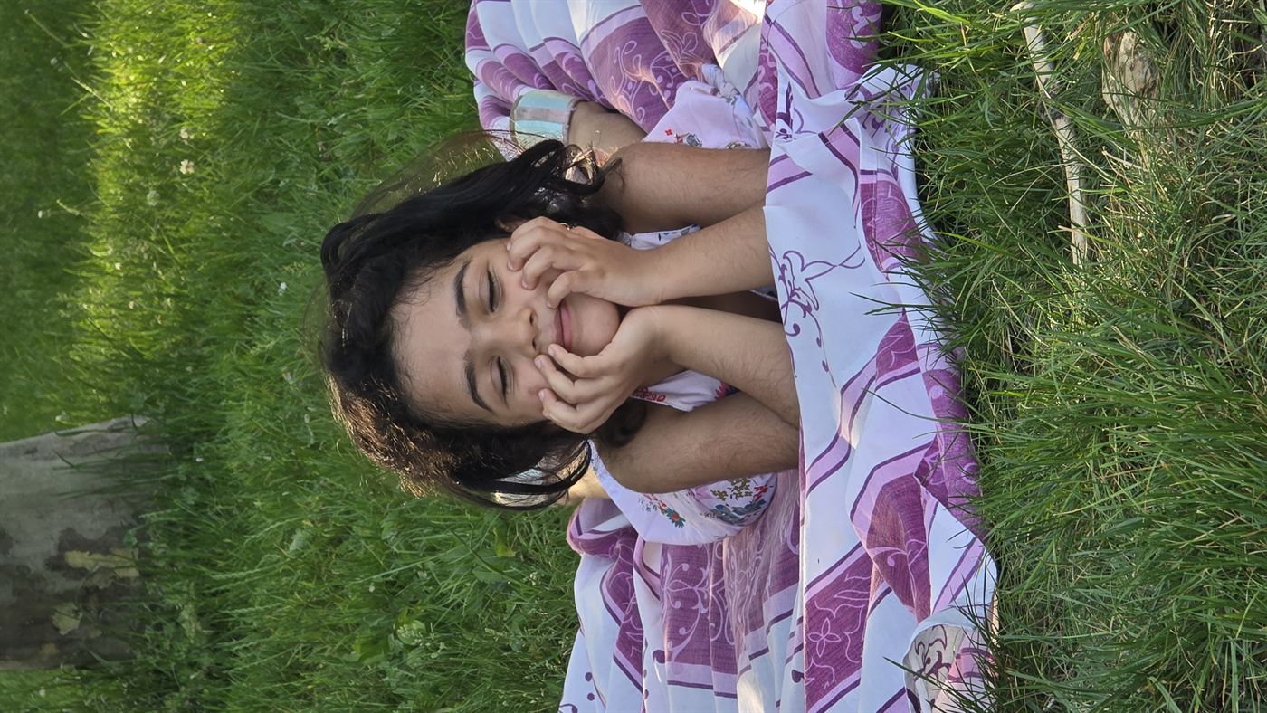 Vaidehi smiling during a family moment
